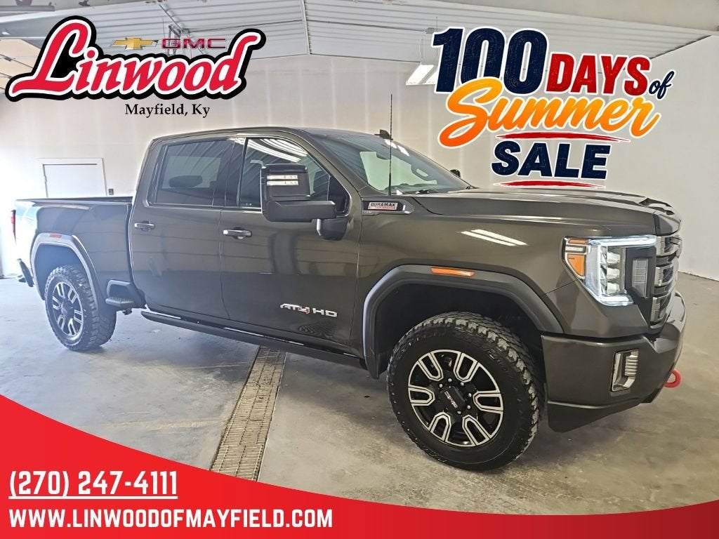 2023 GMC Sierra 3500 HD AT4 in Forest Metallic — front three-quarter view